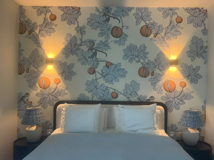 Custom hand-designed botanical mural with monkeys installed above the bed, Jumeirah 2 villa, by La Belle Maison