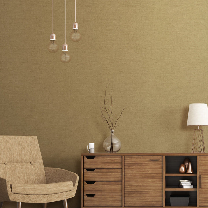 Warm taupe and olive-toned geometric wallpaper in a softly lit room, evoking rich material depth